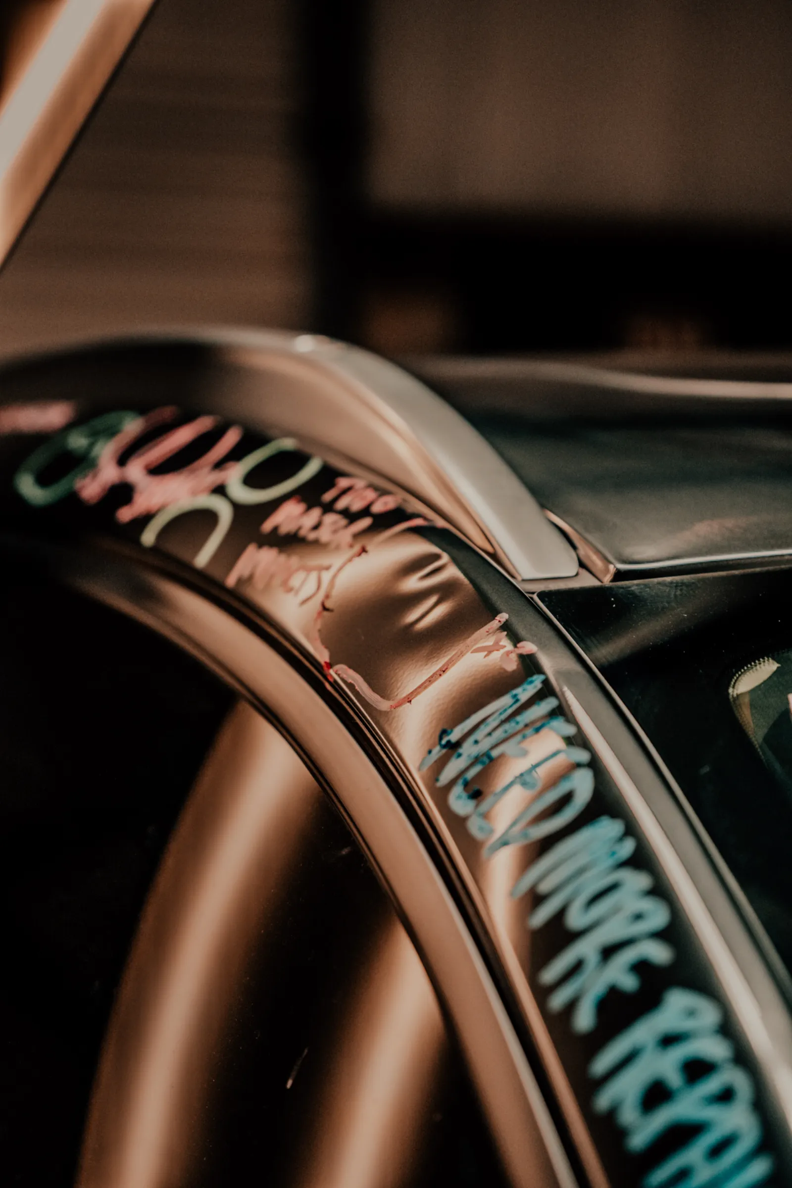 Hail dent close-up on vehicle roof rail before paintless dent repair in Lubbock, TX