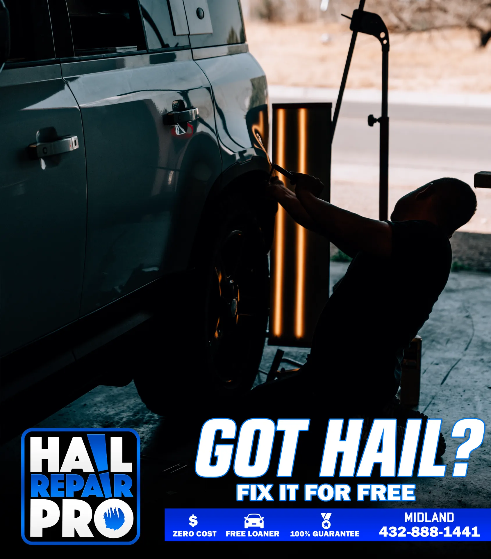 Certified paintless dent repair technician at Hail Repair Pro Lubbock TX glue-pulling a large dent from a quarter panel under PDR reflection lighting — preserving factory paint and resale value